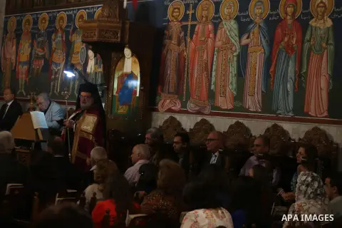 Orthodox Christian worshippers attend a prayer during the Easter Eve mass at the St. Porphyrios church in Gaza City, Saturday, April 15, 2017. Christians have gathered at the church for the fire ceremony that celebrates...