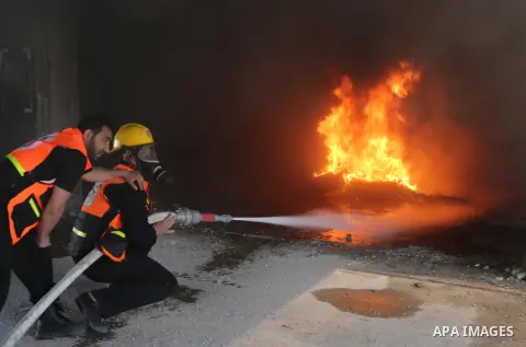 Palestinian Civil Defense members take part in a drill, in Gaza city, on April 18, 2017. Photo by Ashraf Amra