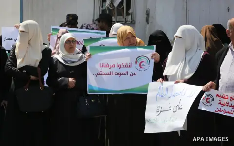 Union of the Palestinian syndicates members hold banners during a protest against Israeli blockade, in Gaza city, on April 19, 2017. Photo by Mohammed Asad