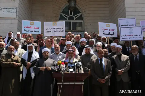 Members of the Palestine Scholars Association take part in a protest against the Israeli blockade of the Gaza Strip in Gaza city on April 19, 2017. Photo by Ashraf Amra