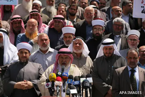 Members of the Palestine Scholars Association take part in a protest against the Israeli blockade of the Gaza Strip in Gaza city on April 19, 2017. Photo by Ashraf Amra