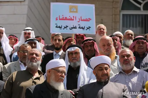 Members of the Palestine Scholars Association take part in a protest against the Israeli blockade of the Gaza Strip in Gaza city on April 19, 2017. Photo by Ashraf Amra