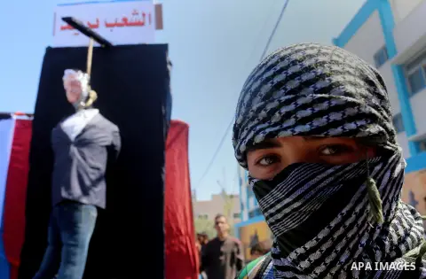 Palestinian children take part in a protest against Palestinian Authority decision to reduce employees salaries and crisis of power outages, in Jabalia refugee camp in the northern Gaza Strip on April 19, 2017. Photo by...