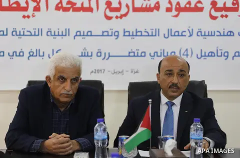Palestinian housing minister Mufeed al-Hasayna, attends a signing ceremony of Italian grant projects in Gaza city on April 20, 2017. Photo by Mohammed Asad