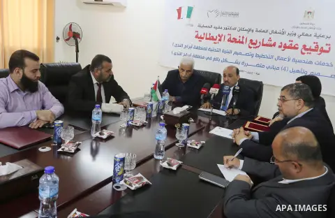 Palestinian housing minister Mufeed al-Hasayna, attends a signing ceremony of Italian grant projects in Gaza city on April 20, 2017. Photo by Mohammed Asad