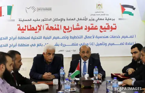 Palestinian housing minister Mufeed al-Hasayna, attends a signing ceremony of Italian grant projects in Gaza city on April 20, 2017. Photo by Mohammed Asad