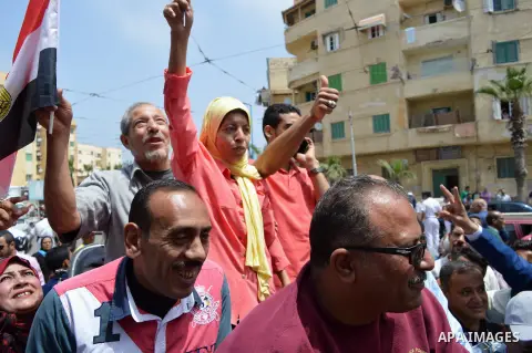 Mona El Sayed, an Egyptian woman known in media as "girl cart" holds an Egypitan national flag before she receives a mini-bus which was funded by “Tahya Masr” (Long Live Egypt) fund in Cairo, Egypt, on April 22, 2017. Ju...