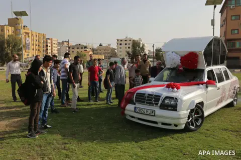 A Palestinian mechanic display his "Cinderella" vehicle in Gaza City on April 22, 2017. Made up of five different cars, it will be rented out for use at marriage ceremonies. Photo by Ashraf Amra