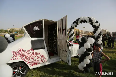 A Palestinian mechanic display his "Cinderella" vehicle in Gaza City on April 22, 2017. Made up of five different cars, it will be rented out for use at marriage ceremonies. Photo by Ashraf Amra