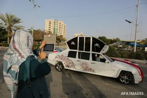 A Palestinian mechanic display his "Cinderella" vehicle in Gaza City on April 22, 2017. Made up of five different cars, it will be rented out for use at marriage ceremonies. Photo by Ashraf Amra