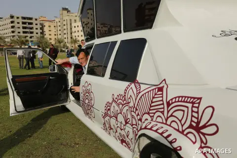 A Palestinian mechanic display his "Cinderella" vehicle in Gaza City on April 22, 2017. Made up of five different cars, it will be rented out for use at marriage ceremonies. Photo by Ashraf Amra
