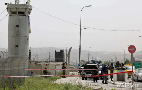 Israeli security forces gather at the site where a Palestinian teenager attempted to stab an Israeli soldier before being shot, at the Hawara checkpoint near the West Bank city of Nablus, on April 26, 2017. A Palestinian...