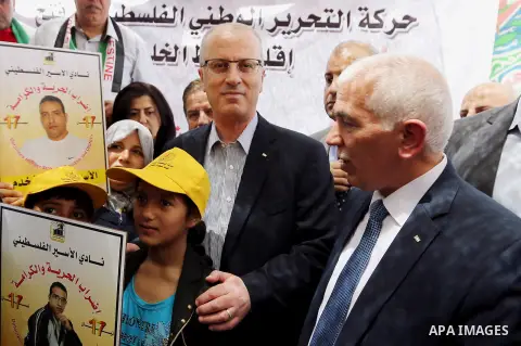 Palestinian Prime Minister Rami Hamdallah takes part in a protest tent in solidarity with Palestinian prisoners on hunger strike in Israeli jails, in the West Bank city of Hebron, in April 29, 2017. Photo by Prime Minist...