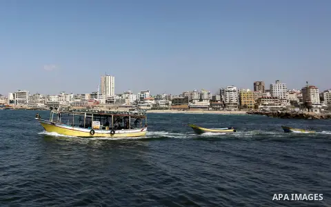 Palestinian fishermen ride their fishing boat at the beach of Gaza City, on May 03, 2017. Israel has eased restrictions on Gaza fishermen, allowing them to travel up to nine nautical miles off the coast of the blockaded...