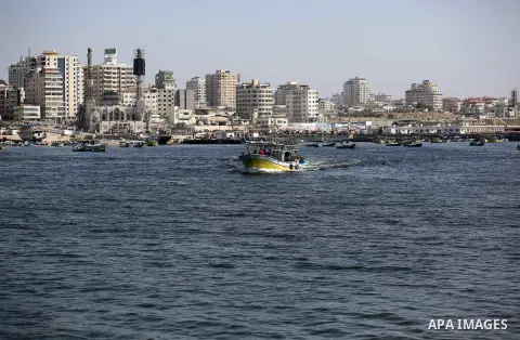 Palestinian fishermen ride their fishing boat at the beach of Gaza City, on May 03, 2017. Israel has eased restrictions on Gaza fishermen, allowing them to travel up to nine nautical miles off the coast of the blockaded...