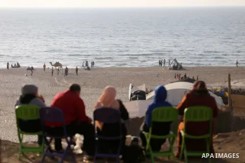 Palestinians enjoy their time off the beach of Gaza City on May 5, 2017. Photo by Mohammed Asad
