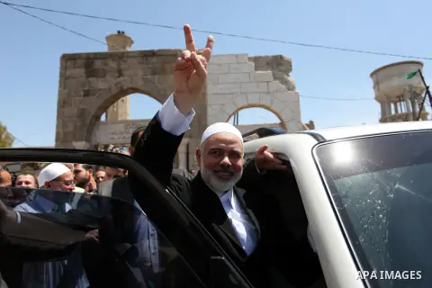 (FILES) This file photo taken on May 6, 2016 shows Palestinian Islamist movement Hamas' chief, Ismail Haniya leaves a mosque after giving a speech during the Friday prayer in Deir al-Balah, in the center of the Gaza Stri...