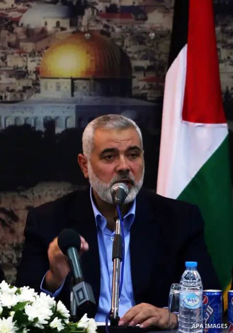 (FILES) This file photo taken on October 9, 2014 shows Senior Hamas leader Ismail Haniyeh speaks during the visit of Palestinian Prime Minister Rami Hamdallah, at Haniyeh's house in Gaza city. Ismail Haniya was elected a...