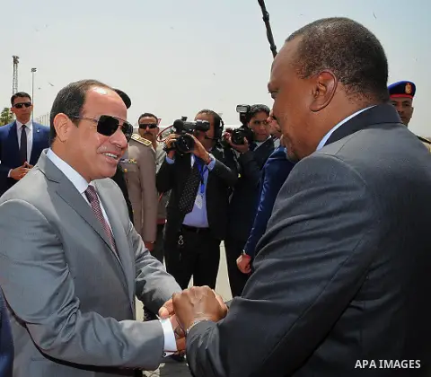 Egyptian President Abdel Fattah al-Sisi welcomes Kenyan President Uhuru Kenyatta upon his arrival at Cairo's international airport in Cairo, Egypt, on May 10, 2017. Photo by Egyptian President Office