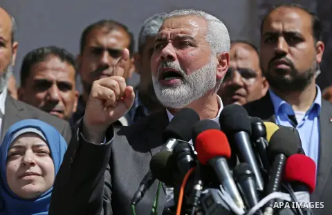 Ismail Haniyeh, leader of Hamas, gives delivers an address during a press conference in Gaza City on May 11, 2017, in which the group announced the arrest of the suspected murderer of one of its key military commanders,...