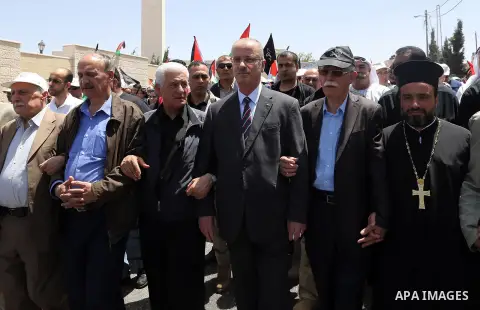 Palestinian Prime Minister Rami Hamdallah takes part in a rally to mark the 69th anniversary of the "Nakba" or "catastrophe" in Arabic in reference to the establishment in 1948 of the state of Israel, in the West Bank ci...