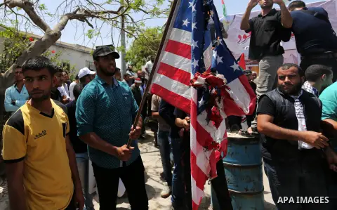 Palestinians burn American flag during a rally to commemorate the 69th anniversary of the "Nakba" in Gaza City, on May 15, 2017. "Nakba" means in Arabic "catastrophe" in reference to the birth of the state of Israel 69-y...