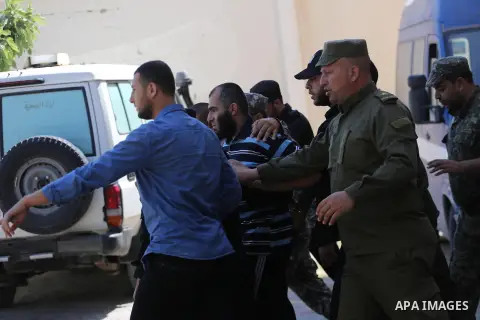 Palestinian security forces escort Ashraf Abu Leila, a 38-year-old Palestinian man convicted of the murder of Hamas military commander Mazen Faqha, out of the military court in Gaza City May 21, 2017. A court in the Gaza...