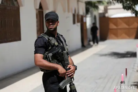 Palestinian Security forces stand guard, out of the military court in Gaza City May 21, 2017. A court in the Gaza Strip sentenced three men to death over the assassination of a Hamas military commander that the Islamist...