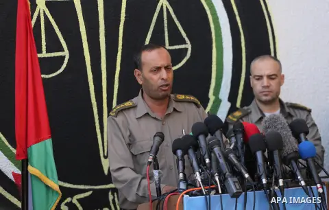Brigadier General, Naser Soliman, speaks during a conference at the military court in Gaza City, on May 21, 2017. A court in the Gaza Strip sentenced three men to death over the assassination of a Hamas military commande...