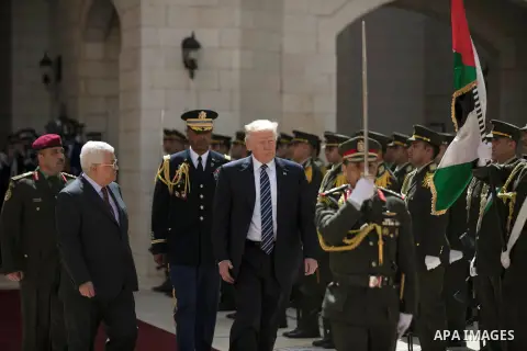 U.S. President Donald Trump and Palestinian President Mahmoud Abbas review the honor guard during a reception ceremony at the presidential headquarters in the West Bank town of Bethlehem, May 23, 2017. APAIMAGES/Fadi Aro...