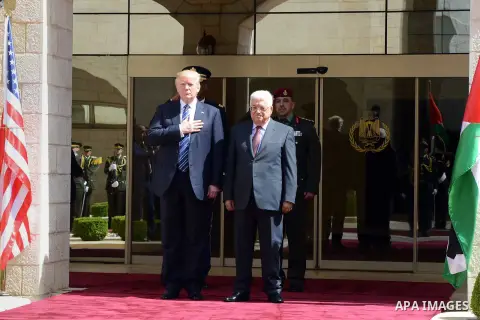 U.S. President Donald Trump and Palestinian President Mahmoud Abbas review the honor guard during a reception ceremony at the presidential headquarters in the West Bank town of Bethlehem, May 23, 2017. Photo by Thaer Gan...