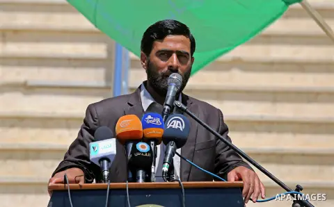 Mushir Al Masri, a Hamas MP and media spokesman, speaks during a protest against U.S. President Donald Trump comments linking Hamas with terrorism and support of prisoners refusing food in Israeli jails in Gaza city on M...