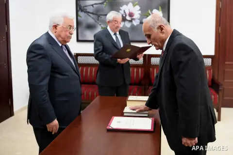 Palestinian President Mahmoud Abbas attends a ceremonial swearing of the head and members of Fatah court, in the West Bank of Ramallah on May 26, 2017. Photo by Osama Falah