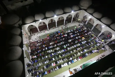 Palestinian Muslim worshipers perform "Taraweeh", nightly prayer of the month of Ramadan, at Sayed Hashim mosque, in Gaza city, on May 26, 2017. Photo by Mohammed Asad