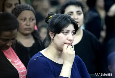 Relatives of the Coptic Christians victims mourn during their funeral at Abu Garnous Cathedral in Minya, some 260 kms south of the capital Cairo, on May 26, 2017. Masked gunmen attacked a bus carrying Coptic Christians o...