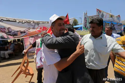 Palestinians celebrate after Palestinian prisoners in Israeli jails suspend hunger strike, in Gaza city on May 27, 2017. Hundreds of Palestinian prisoners on Saturday ended a 40-day hunger strike over conditions in Israe...