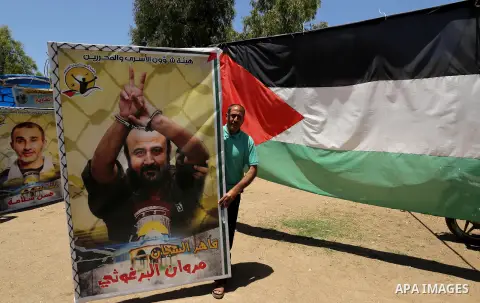 Palestinians celebrate after Palestinian prisoners in Israeli jails suspend hunger strike, in Gaza city on May 27, 2017. Hundreds of Palestinian prisoners on Saturday ended a 40-day hunger strike over conditions in Israe...