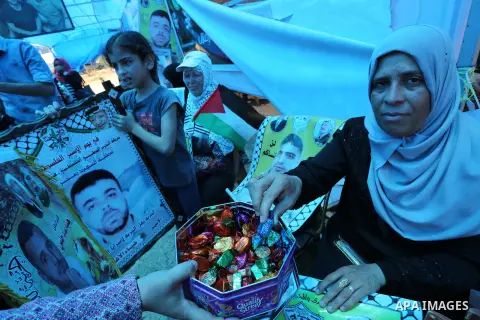 Palestinians celebrate after Palestinian prisoners in Israeli jails suspend hunger strike, in Gaza city on May 27, 2017. Hundreds of Palestinian prisoners on Saturday ended a 40-day hunger strike over conditions in Israe...