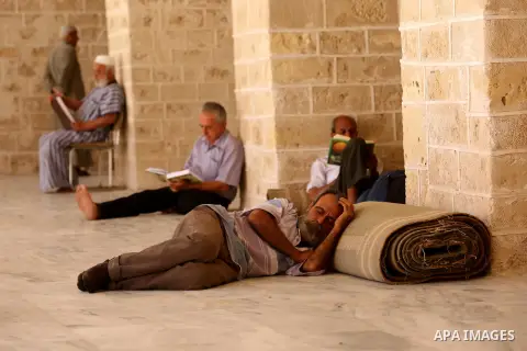A Palestinian man takes a nap on the first day of fasting in the Muslim holy month of Ramadan, at the al-Omari mosque in Gaza City, on May 27, 2017. Ramadan is sacred to Muslims because it is during that month that tradi...