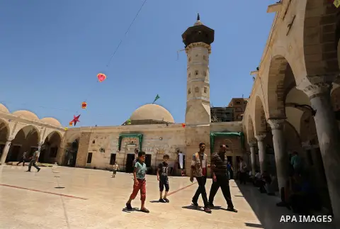 Palestinians walk after prayer at the al- Sayed Hashim mosque on the Muslim holy fasting month of Ramadan in Gaza city on May 29, 2017. Ramadan is sacred to Muslims because it is during that month that tradition says the...