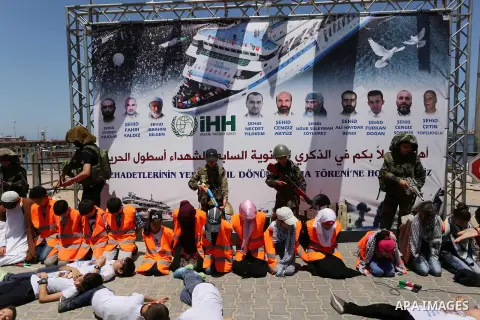 Palestinian children take part during a rally to mark the 7th anniversary of the Mavi Marmara Gaza flotilla incident, as they simulate the raided of Israeli commandos to Mavi Marmara ship, at the seaport of Gaza City May...