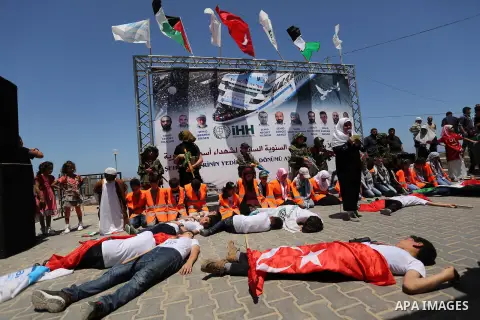 Palestinian children take part during a rally to mark the 7th anniversary of the Mavi Marmara Gaza flotilla incident, as they simulate the raided of Israeli commandos to Mavi Marmara ship, at the seaport of Gaza City May...