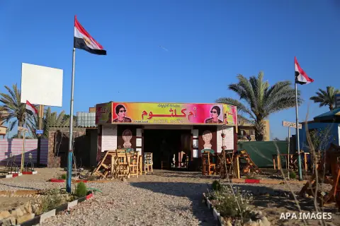 A Palestinian man sits inside the Um Kalthoum Cafe, named after the legendary Egyptian singer who died in 1975 at a technical site in the southern Gaza Strip town of Rafah, near the border with Egypt, on June 1, 2017. Yo...