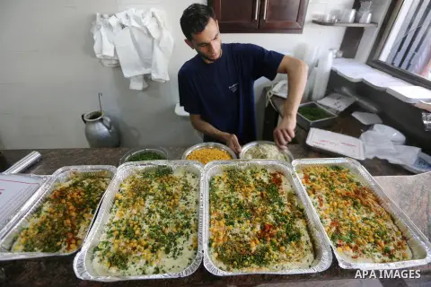 A Palestinian vendor prepares chickpeas known as "Hummus" for breakfasting on the Muslim holy fasting month of Ramadan in Gaza city, on June 03, 2017. Ramadan is sacred to Muslims because it is during that month that tra...