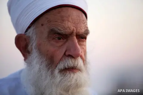 An elderly Samaritan man prays on the top of Mount Gerizim in a traditional pilgrimage to mark the Shavuot's holiday at dawn near the West Bank city of Nablus June 4, 2017 which is giving of the Torah at Mount Sinai seve...