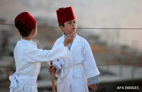 Samaritan children arrive to pray on the top of Mount Gerizim in a traditional pilgrimage to mark the Shavuot's holiday at dawn near the West Bank city of Nablus June 4, 2017 which is giving of the Torah at Mount Sinai s...