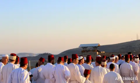 Samaritan worshipers pray on the top of Mount Gerizim in a traditional pilgrimage to mark the Shavuot's holiday at dawn near the West Bank city of Nablus June 4, 2017 which is giving of the Torah at Mount Sinai seven wee...