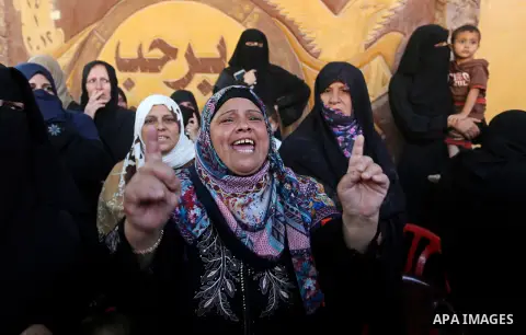 A Palestinian woman reacts during the funeral of a 25-year-old Palestinian Fadi al-Najjar who was killed by Israeli fire in the Gaza Strip during clashes with Israeli sceurity forces at the border fence the previous day,...