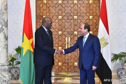 Egyptian President Abdel Fattah al-Sisi shakes hands with President of Burkina Faso, Roch Marc Christian Kabore in Cairo, Egypt, on June 07, 2017. Photo by Egyptian President Office
