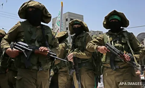 Members of the Ezzedine al-Qassam Brigades, the military wing of the Palestinian Islamist movement Hamas, attend the funeral of their comrade Ibrahim Abu Al-Naja in Rafah, southern Gaza Strip June 8, 2017. Photo by Ashra...